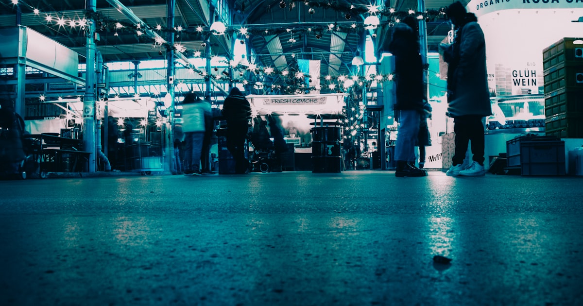 a group of people standing in a building