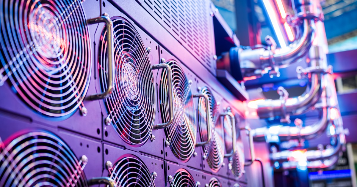 Close-up of server cooling fans in a vibrant data center.
