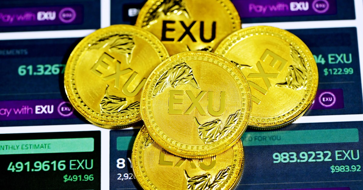 gold round coin on black and white surface