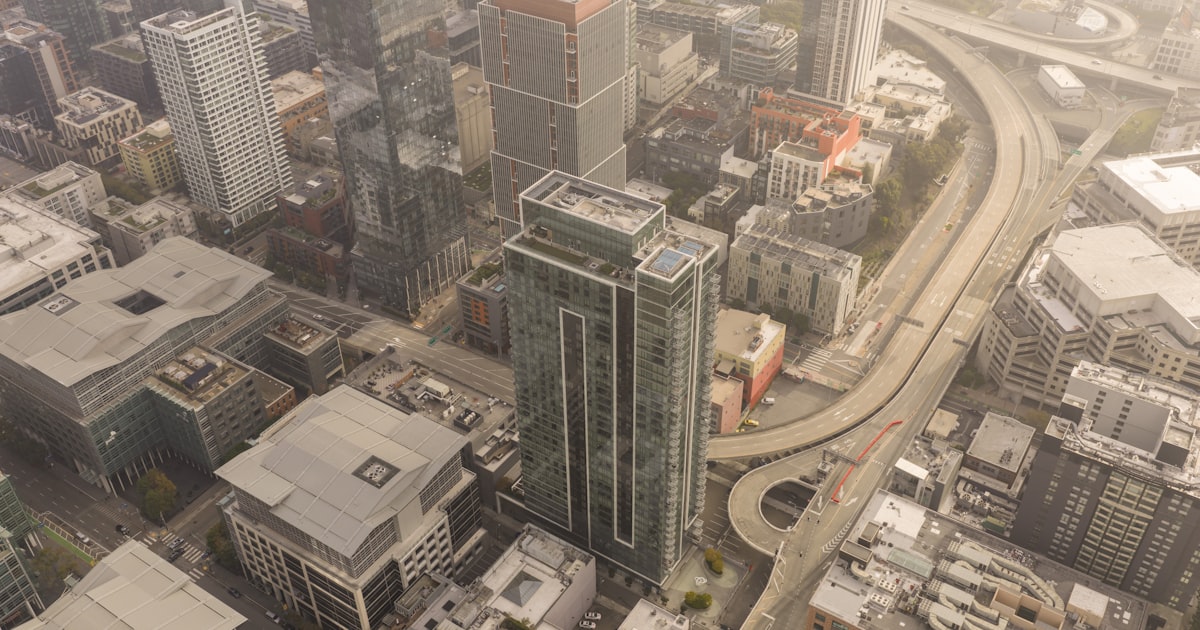 Aerial view of a dense urban cityscape with skyscrapers.