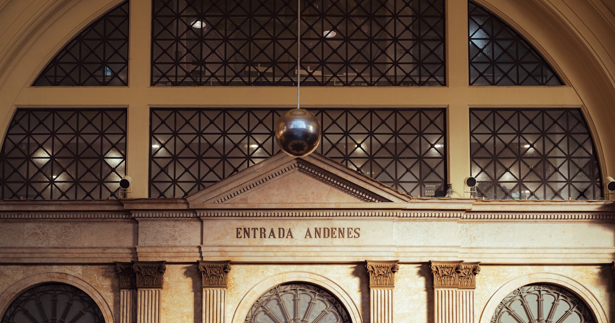 Arched entryway with ornate windows and a disco ball